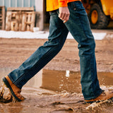Ariat Rebar M4 Relaxed DuraStretch Edge Boot Cut Jean being worn while walking through puddles.