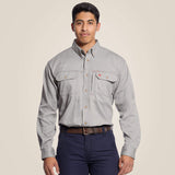 Ariat FR Solid Vent Work Shirt modeled by a young man, showcasing its durable design and utility pockets.
