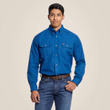 Model wearing an Ariat FR Featherlight Work Shirt in blue, featuring button-down collar and chest pockets.