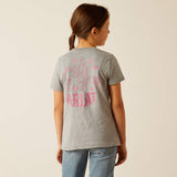 A girl wearing an Ariat Cactus Rose T-Shirt with a cactus graphic on the back, showcasing a stylish design.