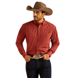 Man wearing Ariat men's Sanders long sleeve shirt in red with cowboy hat and belt buckle.