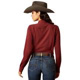 Ariat Womens Kirby Pro Shirt in burgundy, stylishly worn with a cowboy hat and jeans.