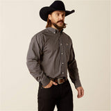 Ariat Wrinkle Free Fields Classic Fit Shirt worn by a model in a cowboy hat, showcasing its stylish design and button-up detail.