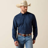 A man wearing an Ariat Printed 360 Airflow Classic Fit Shirt, styled with a cowboy hat and denim jeans.