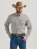 Wrangler George Strait long sleeve button-down shirt with teal print, worn by a man in a cowboy hat.