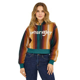 Model wearing Wrangler Retro® Americana Cropped Hoodie in teal with colorful striped design.
