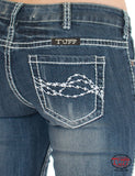 Cowgirl Tuff women's edgy jeans back pocket design featuring intricate stitching and a beautiful blue wash.