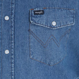 Wrangler Cowboy Cut Work Shirt pocket detail in blue denim with snap closure and logo.