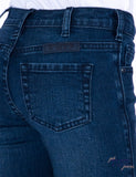 Close-up of the rear pocket of Cowgirl Tuff Just Tuff Girl's Trouser in medium wash denim.