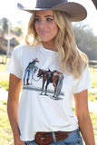 Woman wearing a Cruel Girl® women's crop t-shirt with a graphic of a horse and rider, showcasing a western style.