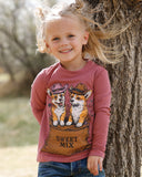 Cruel Girl toddler wearing pink Sweet Mix fox graphic tee with western design, smiling outdoors near a tree.