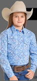 Panhandle Youth Girls Long Sleeve print snap shirt worn by a girl with a cowboy hat, showcasing blue patterned design.