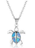 Turtle love pendant necklace featuring a silver turtle with an opal inlay on a delicate chain.