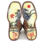 Tin Haul - Puzzler fashion boot soles featuring cowboy graphic and logo design.