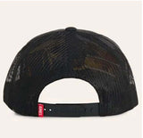 Back view of Kimes Ranch Camden Black Logo Patch Trucker Cap showcasing breathable mesh design and adjustable strap.