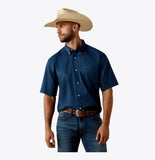 Ariat Men's Key Largo Lightweight Twill Western Shirt in navy with button-down collar, worn with a cowboy hat.