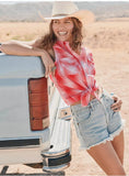 Wrangler Retro Women's Essential Snap Shirt in red, styled with denim shorts and cowboy hat in a western outdoor setting.