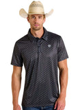 Rock & Roll Denim Men's Black Geo Print Polo worn by a male model, featuring a geometric pattern and cowboy hat.