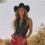 Wrangler x Lainey Wilson Women's Black Denim Sleeveless Western Shirt styled with a cowboy hat.