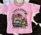 Circle H I Got A Heart Like A Truck Girls Western Graphic Tee in pink with truck and cowboy design.