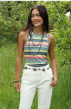 Cruel Girl women's sleeveless tank top with stripes, styled with white pants in a green outdoor setting.