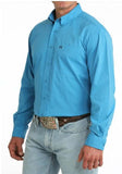 Cinch Men's Arenaflex Long Sleeve Blue Performance Western Shirt worn by a man, showcasing rodeo-ready style.