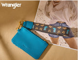 Wrangler women's stylish blue wallet with lanyard on beige background, featuring western print details.