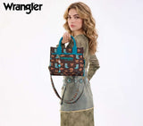 Wrangler Western Print Cowgirl Tote Bag in coffee color held by a model showcasing versatile carrying options.