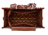 Interior view of Wrangler Women's Paisley Print Tote Crossbody Bag showing brown paisley lining and storage space.