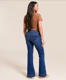 Model wearing 7 for all mankind Medium Melrose Dojo 30" jeans, showcasing the mid rise flare design from the back.