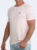 Cinch Men's graphic tee in blush pink with subtle logo on chest, perfect for western lifestyle enthusiasts.