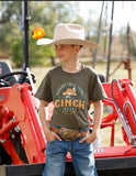 Cinch Boys Short Sleeve Graphic Tee in Olive Green featuring 'Support Local Farms' graphic, worn by a boy on a ranch with big hat.