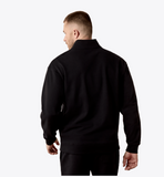 Ariat Men's Caldwell 1/4 Zip in Black, showing the back view of the stylish and functional design.