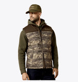 Ariat Men's Crius Insulated Camo Vest worn by a model, perfect for outdoor activities like hunting and riding.