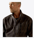Ariat Men's Patriot Flag Softshell Jacket displayed on a model, showcasing its stylish design and functionality.