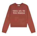 Wrangler Retro® Women's Take Me to the Rodeo Sweater in Rose with contrasting lettering.