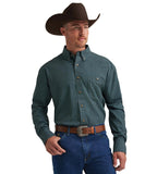 Wrangler George Strait men's green long sleeve stretch shirt styled with a cowboy hat and jeans.