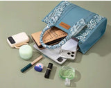 Wrangler Women's Paisley Print Tote Crossbody Bag with various accessories on display