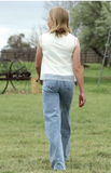 Girl wearing Cruel Girl Girls' High Rise Wide Leg Jean in Light Stonewash, back view in a grassy field.