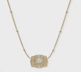 SpurWest Mini Belt Buckle Necklace with a gold chain and decorative buckle, showcasing western heritage in a chic design.