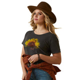 Ariat Women's Sunflower Cow T-Shirt modeled by a woman wearing a brown hat and stylish outfit.