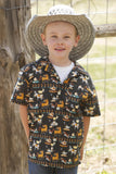 Cinch Boy's Short Sleeve Funny Farm Camp Shirt in Black, featuring playful farm animal prints, model wearing a straw hat.