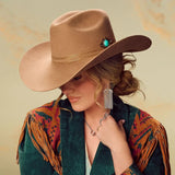 Woman wearing Charlie 1 Horse Keep On Strumming felt western hat in fawn with turquoise details.