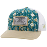 Hooey 'Doc' Hat in teal and white Aztec pattern with tan rectangle patch, featuring 5-panel and OSFA snapback design.