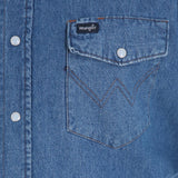 Wrangler Cowboy Cut Work Shirt pocket detail in blue denim with snap closure and logo.