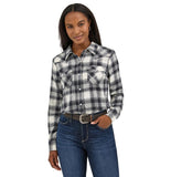 Women wearing Wrangler black flannel shirt, a black and white plaid essential western snap shirt.
