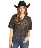 Womens Rock & Roll Denim Black V-Neck Graphic Tee with Studs modeled by a woman in a cowboy hat, featuring decorative studs.