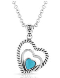 Turquoise heart necklace featuring a turquoise stone in a silver setting with a layered heart design.