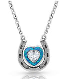Love Inside Luck Horseshoe Necklace featuring a silver pendant with a heart-shaped gemstone in blue and white.
