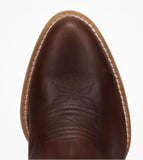Top view of Dan Post Womens Rustic Charm Western Bootie in brown leather, showcasing detailed stitching and smooth toe.